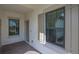 Covered entry with tile flooring and neutral color palette at 26903 Pavin Dr, Englewood, FL 34223