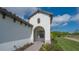 Front entry with arched detail and paver walkway at 26903 Pavin Dr, Englewood, FL 34223
