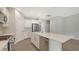 Open concept kitchen with a large island and stainless steel appliances at 26903 Pavin Dr, Englewood, FL 34223
