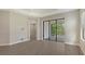 Living area with sliding glass doors leading to a screened patio at 26903 Pavin Dr, Englewood, FL 34223