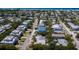 Aerial view of coastal neighborhood, highlighting a newly built three-unit property at 303 65Th St # B, Holmes Beach, FL 34217