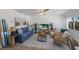 Coastal living room with comfy seating and large TV at 303 65Th St # B, Holmes Beach, FL 34217