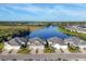 Aerial view of homes on the water with pristine landscaping and access to lake at 3115 Trustee Ave, Sarasota, FL 34243