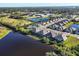 Aerial view of the community with lakes, a recreational field and a clear view of the neighborhood at 3115 Trustee Ave, Sarasota, FL 34243