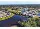 This is an aerial view of the community and homes surrounding the lake at 3115 Trustee Ave, Sarasota, FL 34243