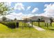 Fenced dog park with shaded seating and play area for furry friends at 3115 Trustee Ave, Sarasota, FL 34243