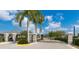 The gated entrance to the community features black iron gates and beautiful landscaping at 3115 Trustee Ave, Sarasota, FL 34243