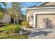 Well-maintained yard leading to two car garage and beautiful plants at 3115 Trustee Ave, Sarasota, FL 34243