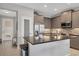 Modern kitchen boasts stainless steel appliances, sleek countertops, and stylish backsplash at 3115 Trustee Ave, Sarasota, FL 34243