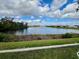 Enjoy breathtaking views of a calm lake from the backyard at 3115 Trustee Ave, Sarasota, FL 34243