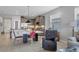 Open-concept living room showcases modern decor, island seating, and sleek tile flooring at 3115 Trustee Ave, Sarasota, FL 34243