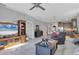 Spacious open-concept living room with sleek flooring, recessed lighting, and view to the kitchen at 3115 Trustee Ave, Sarasota, FL 34243