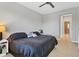 This stylish main bedroom includes a tile floor, a ceiling fan, and an ensuite bath at 3115 Trustee Ave, Sarasota, FL 34243