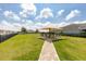Community outdoor space with seating area and lush greenery for relaxing at 3115 Trustee Ave, Sarasota, FL 34243