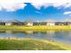 Picturesque pond view with backyard and ducks, creating a serene and inviting atmosphere at 3115 Trustee Ave, Sarasota, FL 34243