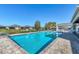 Community pool with lakeside view for a relaxing swim and a beautiful backdrop at 3115 Trustee Ave, Sarasota, FL 34243