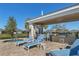 Community pool with lounge chairs, tables and BBQ grill for outdoor entertainment at 3115 Trustee Ave, Sarasota, FL 34243