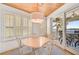 Bright dining area with water views and white shutters at 318 Bay S Dr # 7, Bradenton Beach, FL 34217