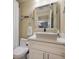 Clean bathroom with white vanity, toilet and shower at 3272 Lake Bayshore Dr # 515, Bradenton, FL 34205