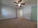 Well-lit bedroom with ceiling fan and walk-in closet at 3520 57Th Avenue W Cir # 10, Bradenton, FL 34210