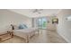 Spacious main bedroom with a king-size bed and private balcony access at 360 Gulf Of Mexico Dr # 322, Longboat Key, FL 34228