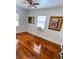 Charming bedroom with hardwood floors, window, and ceiling fan at 3642 Dartmouth N Ave, St Petersburg, FL 33713