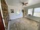 Bedroom featuring carpet, ceiling fan, and wood accent wall at 3642 Dartmouth N Ave, St Petersburg, FL 33713