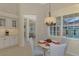 Bright breakfast nook with a view of the pool and backyard at 396 Lansbrook Dr, Venice, FL 34292