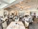 Elegant dining room with white tablecloths and large windows at 396 Lansbrook Dr, Venice, FL 34292