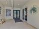 Front porch with double doors, window and patio at 396 Lansbrook Dr, Venice, FL 34292