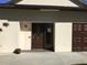 Condo building exterior showcasing entrance and landscaping at 4067 Lake Bayshore Dr # 302, Bradenton, FL 34205