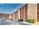 Exterior view of a multi-story condominium building with parking at 4067 Lake Bayshore Dr # 302, Bradenton, FL 34205