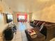 Spacious living room with L-shaped sectional sofa and tile flooring at 4067 Lake Bayshore Dr # 302, Bradenton, FL 34205