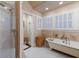 Elegant bathroom featuring a clawfoot tub and walk-in shower at 4110 Riverview Blvd, Bradenton, FL 34209