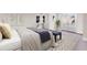 Bright bedroom with water views and a comfy sitting area at 4110 Riverview Blvd, Bradenton, FL 34209