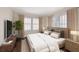 Main bedroom with wood bed frame and neutral decor at 4110 Riverview Blvd, Bradenton, FL 34209