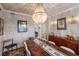 Spacious dining room with wood table and chandelier at 4110 Riverview Blvd, Bradenton, FL 34209