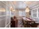 Elegant dining room featuring a long wood table, chandelier, and white trim at 4110 Riverview Blvd, Bradenton, FL 34209