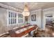 Bright dining room featuring wood table and chandelier at 4110 Riverview Blvd, Bradenton, FL 34209