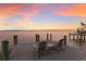 Dock featuring two chairs for relaxing and watching the sunset over the water at 4110 Riverview Blvd, Bradenton, FL 34209