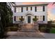 Two story home with a green door and brick steps at 4110 Riverview Blvd, Bradenton, FL 34209