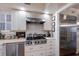 Modern kitchen with stainless steel appliances and white cabinets at 4110 Riverview Blvd, Bradenton, FL 34209