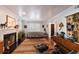 Inviting living room with a fireplace, neutral sofa, and hardwood floors at 4110 Riverview Blvd, Bradenton, FL 34209