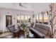 Sunroom with stunning sunset views, comfortable seating, and plenty of natural light at 4110 Riverview Blvd, Bradenton, FL 34209