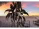Stunning waterfront view with private dock at sunset at 4110 Riverview Blvd, Bradenton, FL 34209