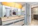 Double vanity bathroom with access to a separate shower at 4239 Durant St, Port Charlotte, FL 33948