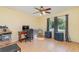 Bright home office features wood floors, large window, and built-in shelving at 4239 Durant St, Port Charlotte, FL 33948