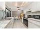 Efficient kitchen with white cabinets and view of dining area at 4239 Durant St, Port Charlotte, FL 33948