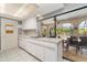 Galley-style kitchen with ample counter space and access to the backyard at 4239 Durant St, Port Charlotte, FL 33948