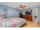 Main bedroom with king-size bed, large TV, and lots of natural light at 4239 Durant St, Port Charlotte, FL 33948